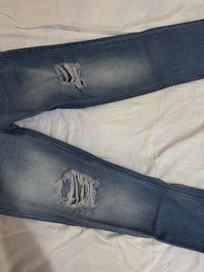 Distressed Blue Denim Jeans