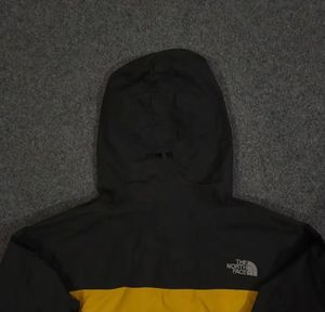 THE NORTH FACE YELLOW AND BLACK JACKET