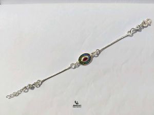 Elegant Pure Silver Oval Stone Rakhi