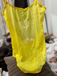Yellow one-piece swimsuit with a deep scoop back