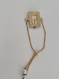 Elegant Gold Watch with Pearl Detail