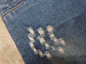 Distressed Blue Denim Jeans