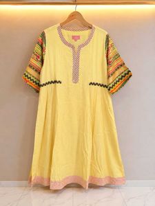 A  yellow colour  anarkali goun with red scarf