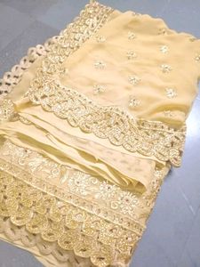 Exquisite Cream Saree with Gold Embellishments
