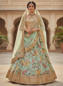 Pastel green lehenga with golden sequin blouse