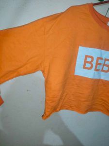 Cute BEBE Cropped Orange Long Sleeve Top