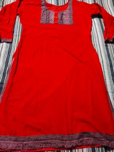 Vibrant Red Kurta with Intricate Neckline