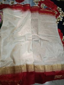 White saree with red border