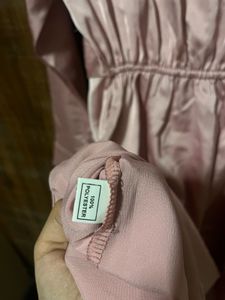 Imported satin finish twist front dress.