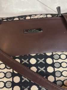 Chic Brown Handbag with Unique Pattern