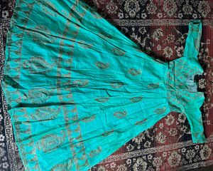 Beautiful Teal Ethnic Gown with Gold Print know an