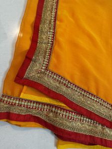 Vibrant Orange Saree with Brocade Blouse