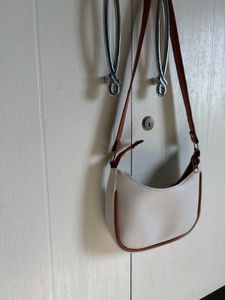 Chic White Hobo Bag with Brown Trim
