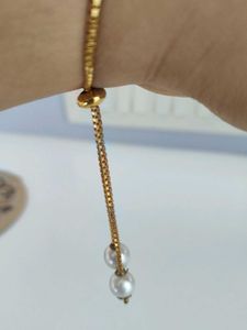 Elegant Gold Watch with Pearl Detail