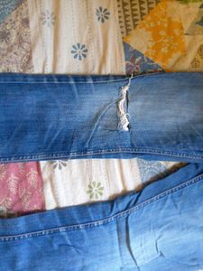 Distressed Blue Denim Jeans