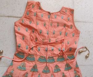 Ethnic peach gown with rich embroidery