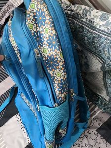 Blue Backpack with Floral Pattern
