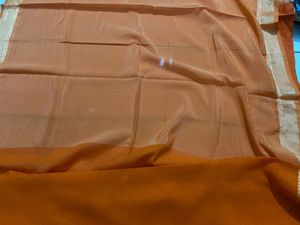 Elegant Orange Saree with Golden Border and  uns