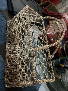 Woven basket on a metal frame