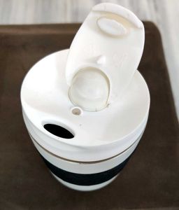 Stylish White Travel Mug with Black Grip