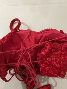 red backless blouse