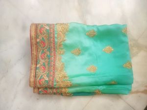 Elegant Teal Saree with Gold Embroidery
