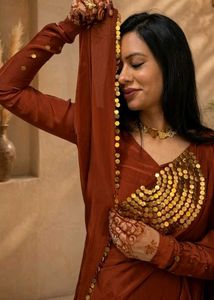 Elegant Maroon Saree with Gold Embellishments