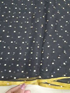 Elegant Black Saree with Gold Accents