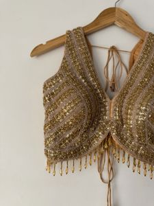 Embellished V-Neck Sleeveless Blouse