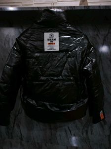 Chic Black Puffer Jacket with Orange Accents