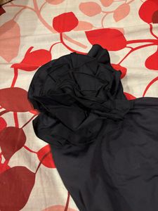 Chic Black One-Shoulder Top with Flower Accent