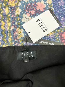 Black draped around breadeau top