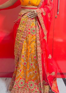 Exquisite Yellow & Red Embroidered Lehenga Choli