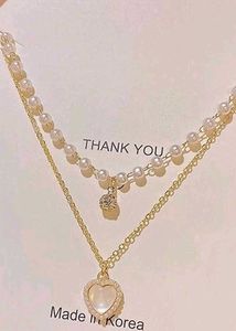 Layered Pearl Necklace with Heart Pendant