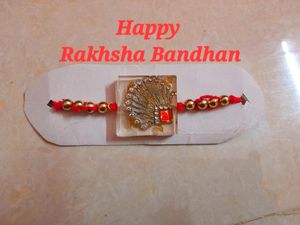 Glamorous Rakhi with Red &amp; Gold Accents