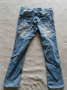 Distressed Light Wash Denim Jeans
