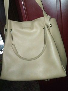 Stylish Beige Handbag with Tassel Accent