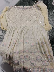 Elegant Cream Kurta Set with Intricate Embellishme