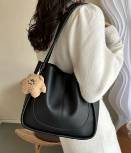 Chic Black Tote Bag with Cute Charm