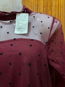 Polka dotted sheer top