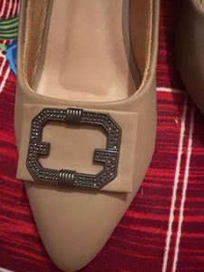 Elegant Beige Heels with Decorative Buckle