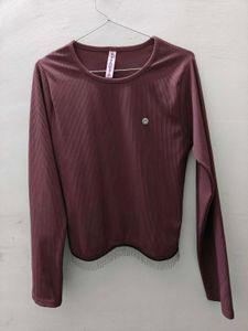 Ribbed Long Sleeve Top with Fringed Hem