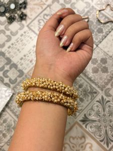 Elegant Pearl and Gold Bangles
