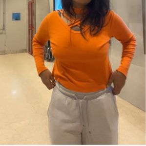 Orange Cut-Out Turtleneck Top