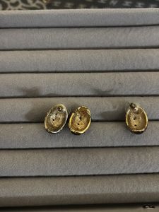 Elegant BAZA Vintage Tone Earrings with doller