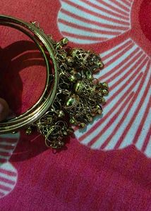 Set of 4 Gold Tone Bangles with Charms