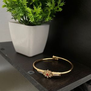 Elegant Gold Bracelet with Red Stone