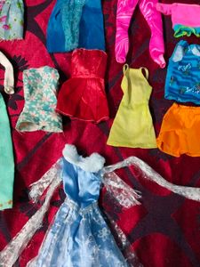 new and old Barbie dolls cloth lot