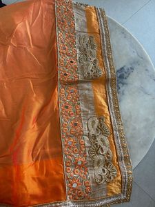 Elegant Orange Saree with Intricate Border