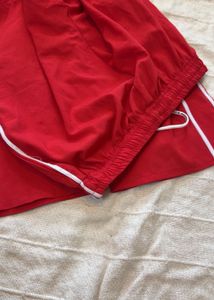 Red Track Pants with White Stripes